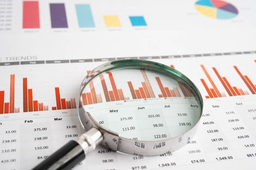Magnifying glass on chart paper photo