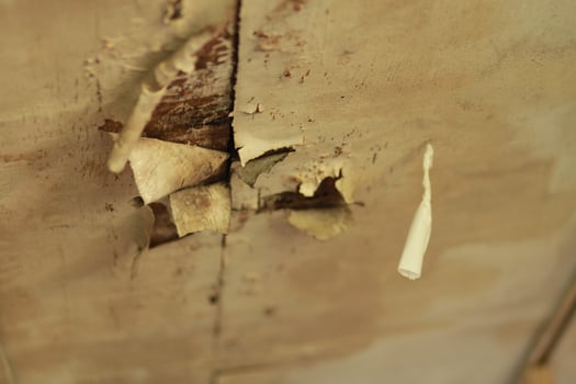 a toothbrush is stuck in a wall photo