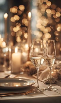 Two champagne glasses on a table photo