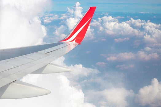 clouds and airplane wing from above photo