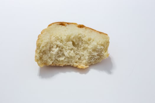 bitten piece of old white bread photo
