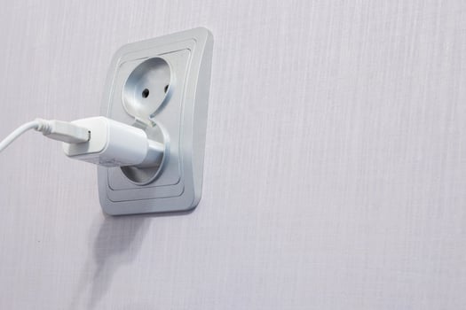 the cord is plugged into an outlet photo