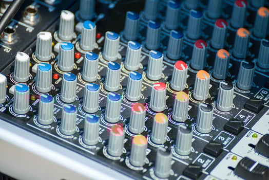 The knobs and buttons of an audio equalizer and mixing board. Audio Equipment photo