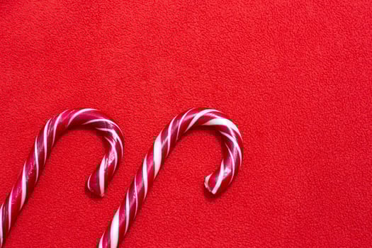 Christmas red fabric background and candy. photo