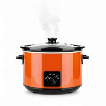Orange slow cooker with glass lid emitting steam on white background kitchen appliance cooking photo