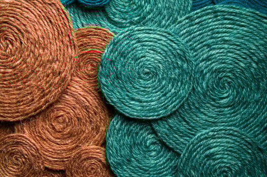 Green and red background made of hard woolen textile material close-up. Fabric with natural texture. Fabric background photo