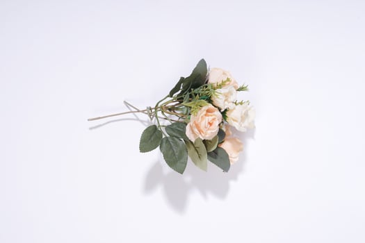 Overhead View of a Beautiful Artificial Peach Rose Bouquet photo
