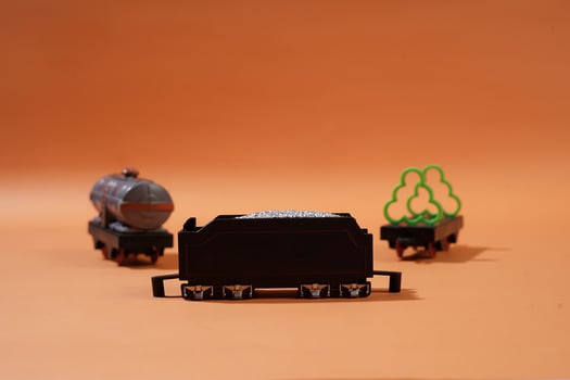 Playful Toy Train Wagons on a Warm Orange Background photo