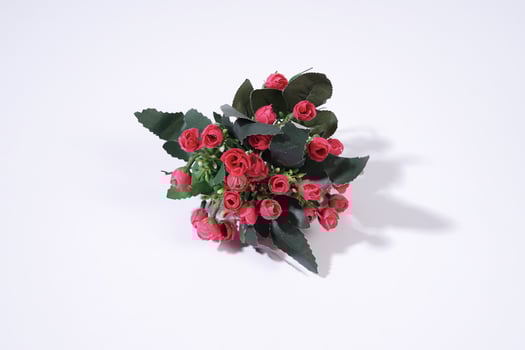 Small Bouquet of Red Berries and Green Leaves. synthetic flowers photo