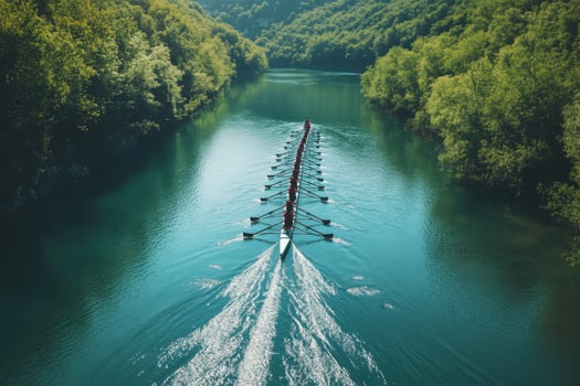 A boat traveling down a river in the middle of a forest photo