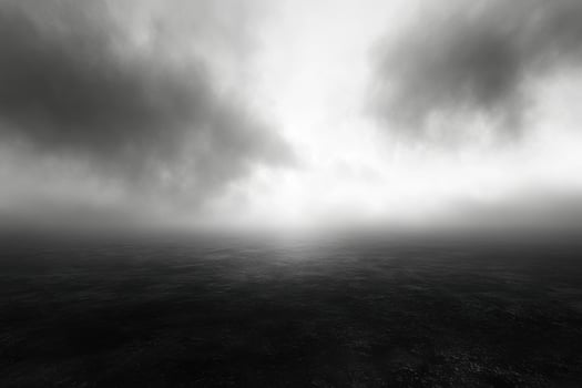 A black and white photo of a dark and cloudy sky