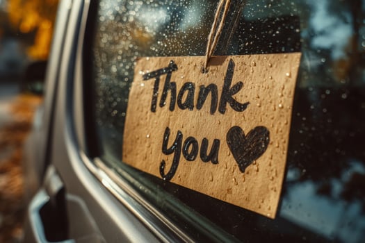 Thank you note on car window photo