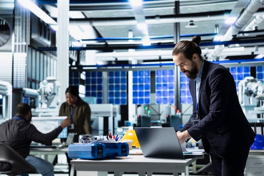 Solar panel master engineer in a high tech factory doing an inspection, quality control production metrics. Professional consultant ensuring industrial operations for development. photo