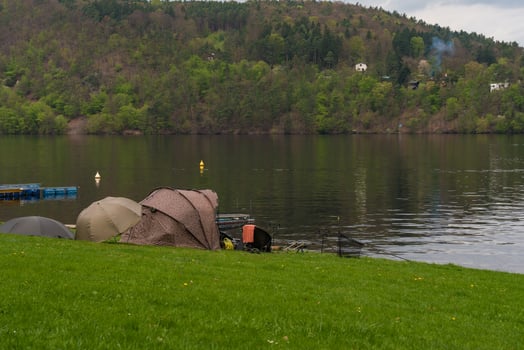 Fishing tents and rods on riverbank at Nova Zivohost, Czech Republic photo