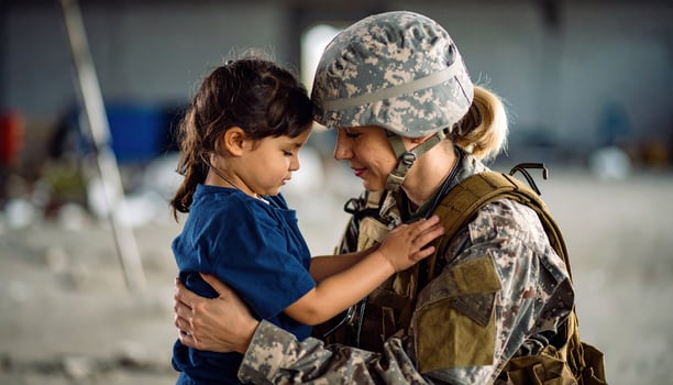 Female soldier shares heartfelt embrace with young child, expressing profound love during tender reunion. Emotional family bond captured in bittersweet homecoming hug between woman and child photo
