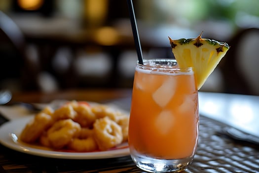 Refreshing Tropical Drink With Pineapple Garnish And Appetizers. photo