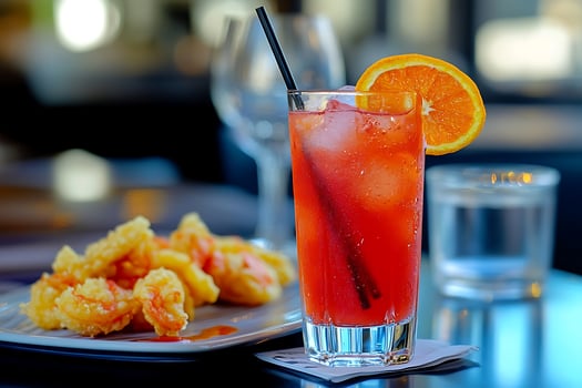 Refreshing Red Cocktail with Golden Fried Shrimp Appetizer. photo