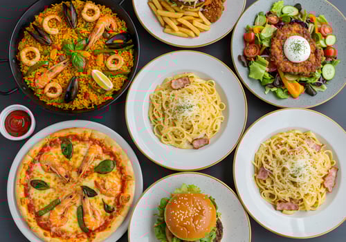 A variety of different types of food on white plates photo