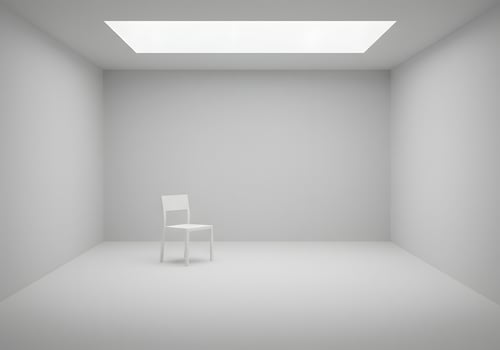 Empty room with chair and skylight photo