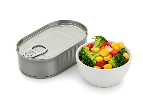 A can of tuna and a bowl of vegetables photo