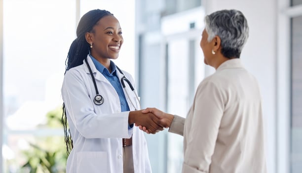 Warm and reassuring handshake between healthcare professional and patient symbolizes trust and compassion in medical setting, fostering positive relationship photo