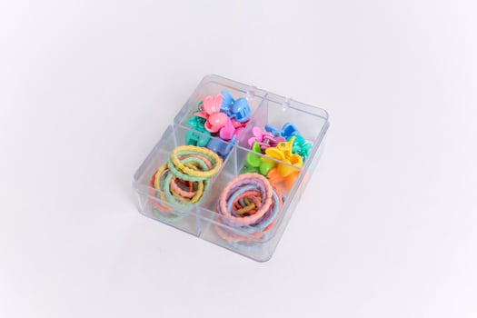 Colorful children's hair accessories on white background photo