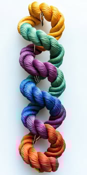A group of colorful rope bracelets on a white surface photo