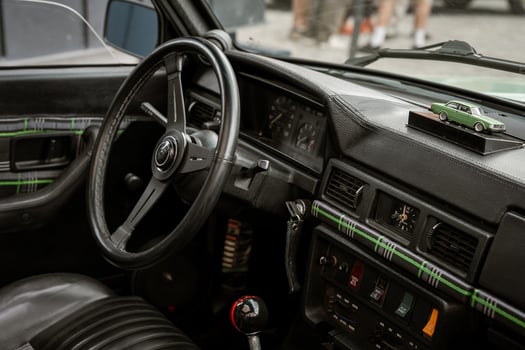 Vintage Car Interior with Dashboard and Model Car photo