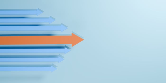 3D orange arrow breaking from blue arrows moving in same direction, symbolizing innovation, leadership, uniqueness, and business strategy. photo