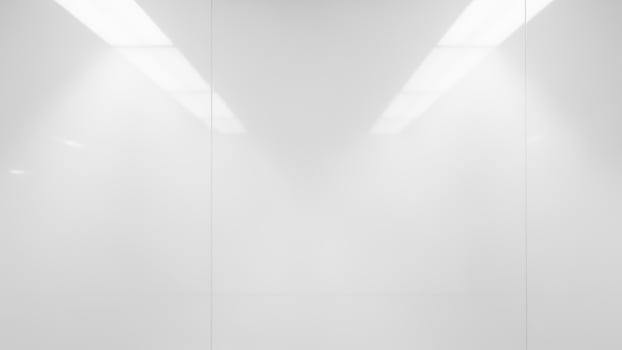 White room with light coming from the ceiling photo