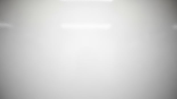 A white room with a light shining on it photo