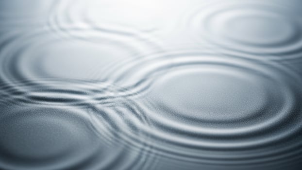 Water ripples on a surface with a circular pattern photo