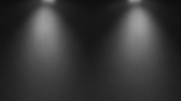 Black and white photo of two spotlights