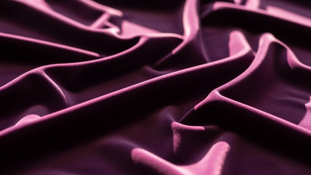 A purple fabric with folds and folds photo
