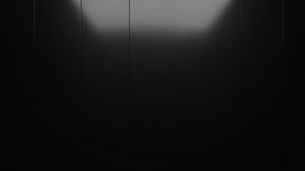 A black background with a light shining through it photo