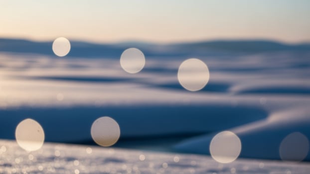 A snow covered field with circles of light photo