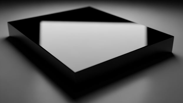 A black square box sitting on a table photo