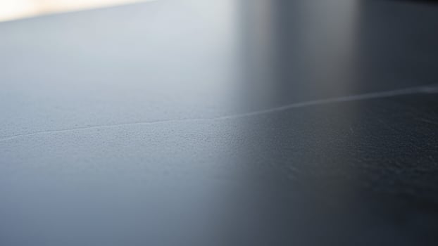 A close up of a black surface with a white line photo
