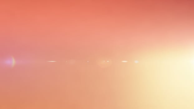 A bright orange and yellow background with a sun in the sky photo