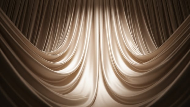 A curtain with a light shining through it photo