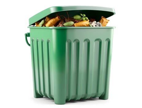 A green trash can with food and other items photo