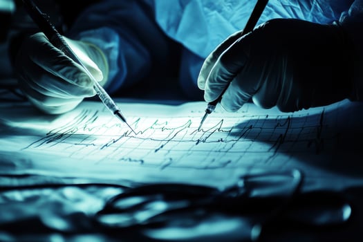 A person in a lab coat is writing on a piece of paper photo