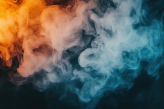 Colorful smoke on a black background photo