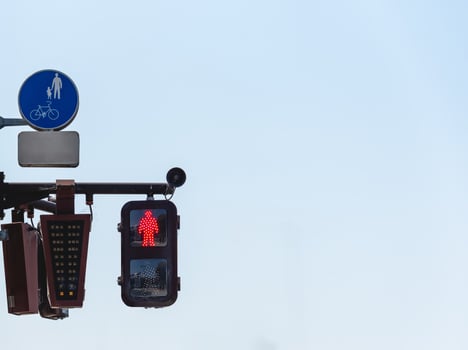 Street light at a pedestrian crossing. Traffic signal controlled pedestrian facilities. photo