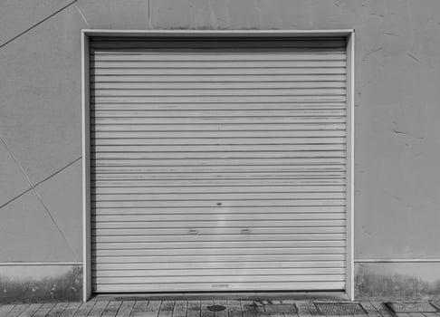 Closed steel door for steel metal store door background and texture. photo