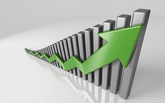 Green arrow shows upward trend on bar chart photo