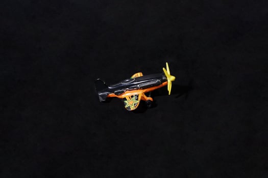 Super Jet. Colorful Toy Helicopter on a Dark Background photo