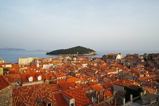 Exterior European architecture design and decoration of Dubrovnik old town city walls and landscape with clear blue sky, southern Croatia fronting the Adriatic sea encircled with massive stone photo