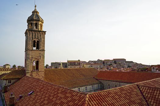 Exterior European architecture and top decoration design of Dubrovnik old town city walls and landscape with clear blue sky, southern Croatia fronting the Adriatic sea encircled with massive stone photo