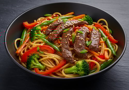 A bowl of noodles and beef photo